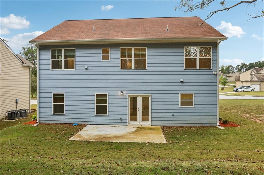 4405 Belcamp Road Fairburn, GA 30213 - Photo 49 of 60 a front view of a house with a yard
