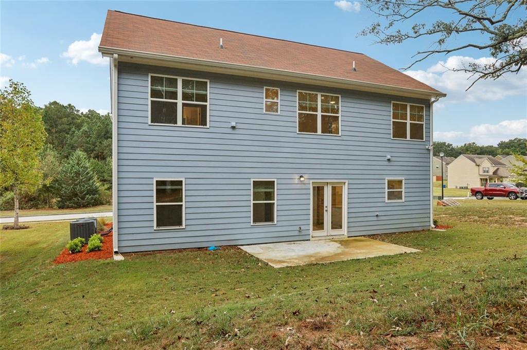 4405 Belcamp Road Fairburn, GA 30213 - Photo 50 of 60 a view of a house with a yard