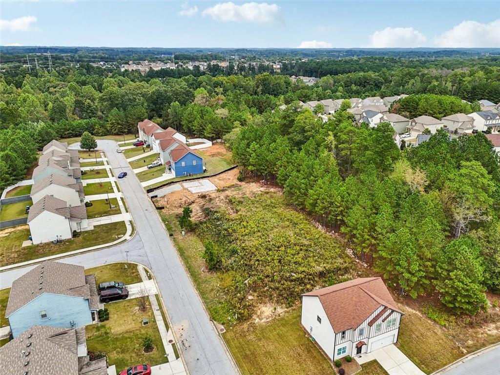 4405 Belcamp Road Fairburn, GA 30213 - Photo 54 of 60 an aerial view of residential houses with outdoor space