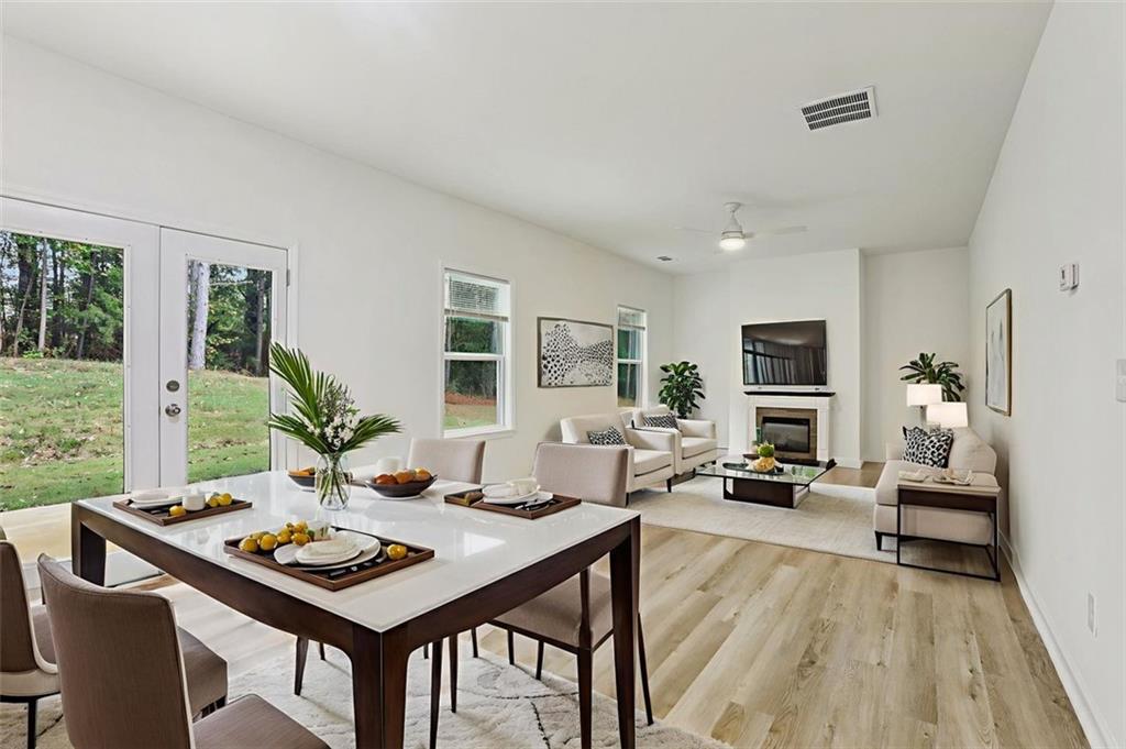4405 Belcamp Road Fairburn, GA 30213 - Photo 7 of 60 a living room with furniture and a table