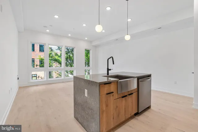 a kitchen that has a lot of cabinets in it