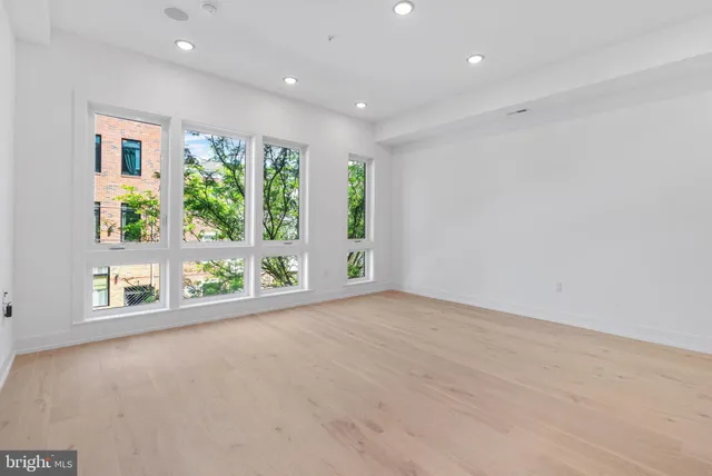 a view of a room with large windows