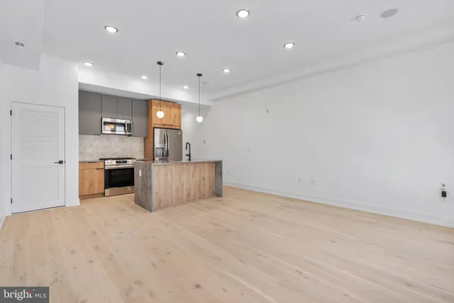 a view of a kitchen with a sink