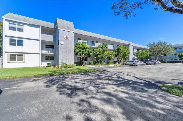 a front view of a building with garden