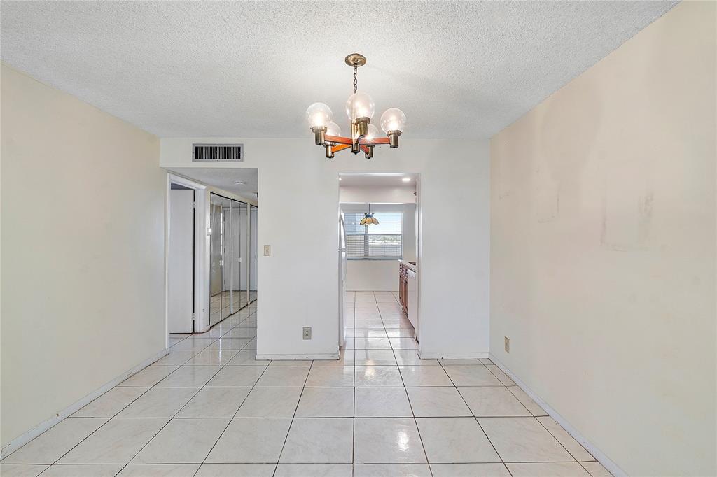 8205 Northwest 61st Street, Unit B305 Tamarac, FL 33321 - Photo 11 of 50 a view of an empty room with a window