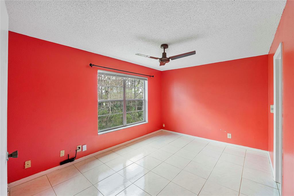 8205 Northwest 61st Street, Unit B305 Tamarac, FL 33321 - Photo 16 of 50 an empty room with windows