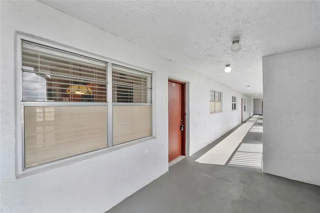 a view of livingroom with hardwood floor and hallway