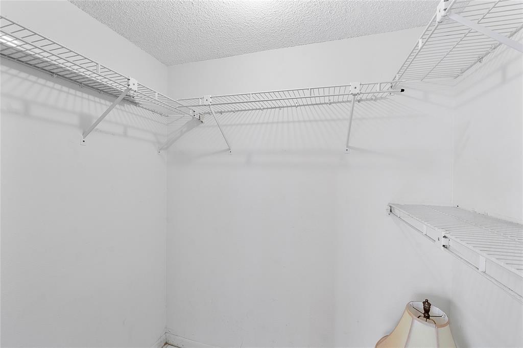 8205 Northwest 61st Street, Unit B305 Tamarac, FL 33321 - Photo 26 of 50 a view of a room with racks on the wall