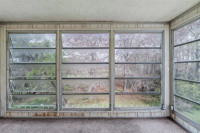 an aerial view of a golf course with parking space