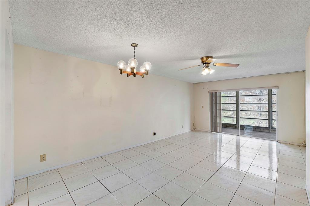 8205 Northwest 61st Street, Unit B305 Tamarac, FL 33321 - Photo 10 of 50 a view of an empty room with a window