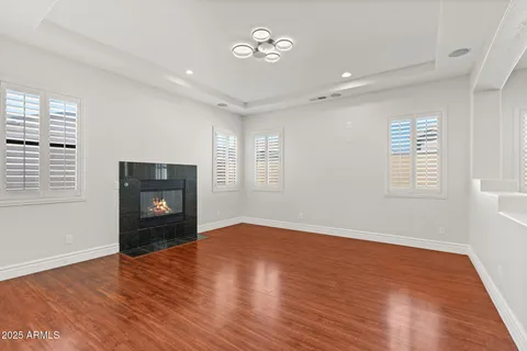 a bathroom with a granite countertop sink a toilet and shower