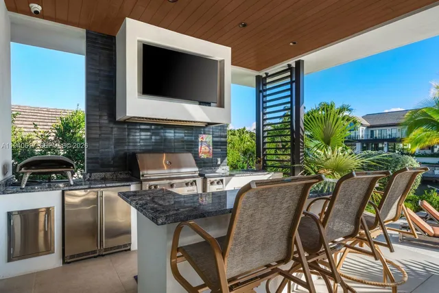 a view of a backyard with plants and a patio