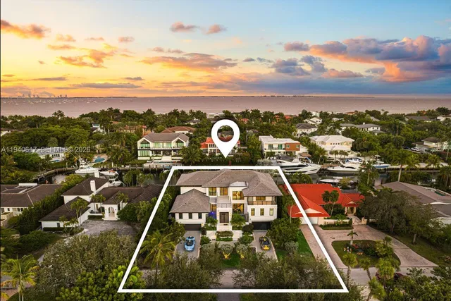 an aerial view of a house with outdoor space