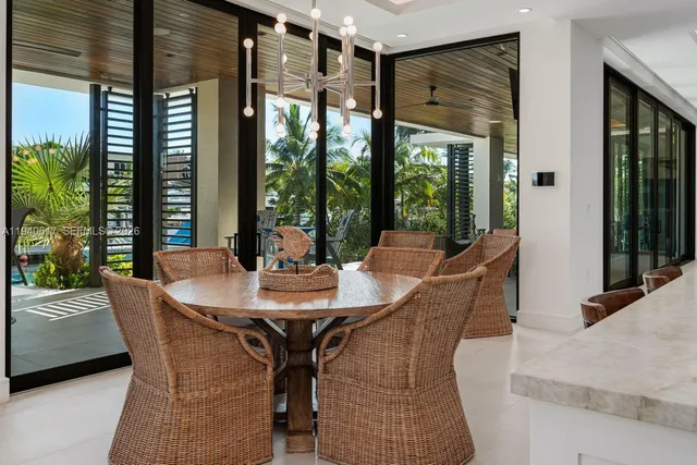 a spacious bedroom with a bed a couch and a flat tv screen