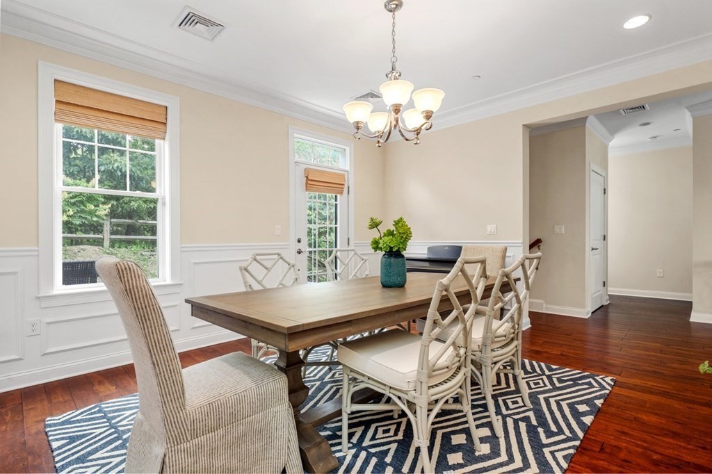 113 Halsted, Unit 113 Hingham, MA 02043 - Photo 14 of 41 a view of a dining room with furniture window and wooden floor