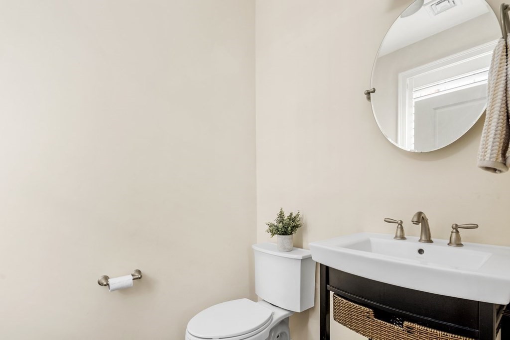 113 Halsted, Unit 113 Hingham, MA 02043 - Photo 16 of 41 a bathroom with a sink and a mirror