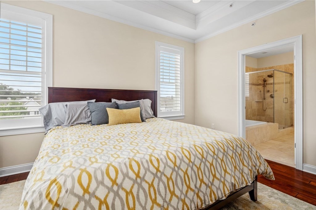 113 Halsted, Unit 113 Hingham, MA 02043 - Photo 17 of 41 a bed sitting in a bedroom next to a window