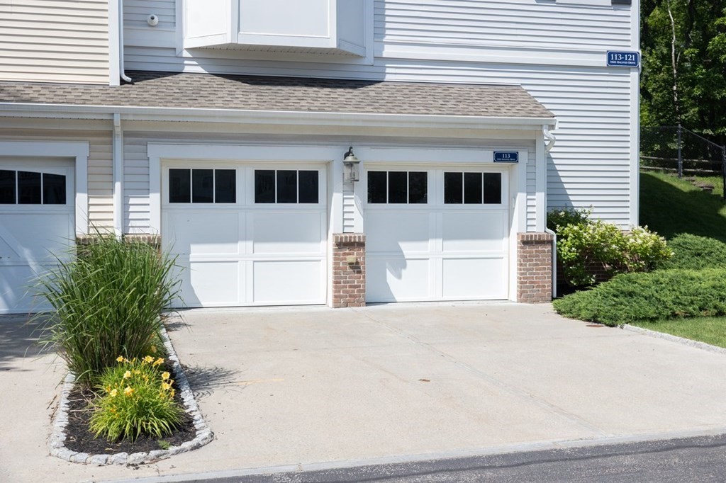 113 Halsted, Unit 113 Hingham, MA 02043 - Photo 28 of 41 a front view of a house with a yard and a garage