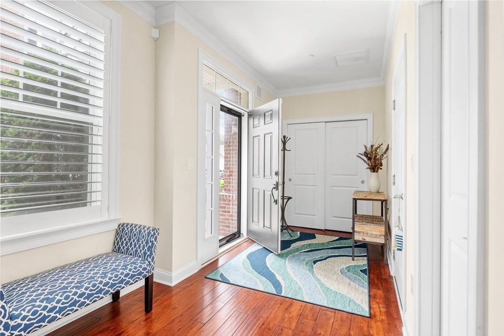 113 Halsted, Unit 113 Hingham, MA 02043 - Photo 3 of 41 a bedroom with a bed and a window