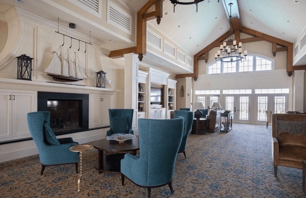 113 Halsted, Unit 113 Hingham, MA 02043 - Photo 32 of 41 a living room with furniture a fireplace and a large window