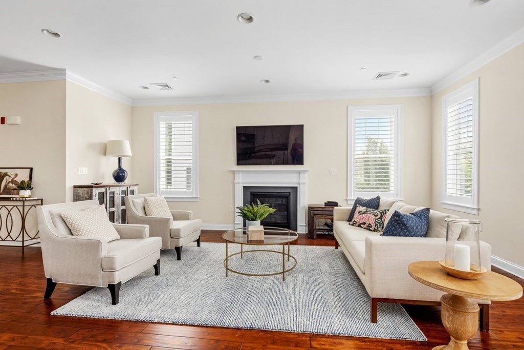 113 Halsted, Unit 113 Hingham, MA 02043 - Photo 8 of 41 a living room with furniture a fireplace and a flat screen tv