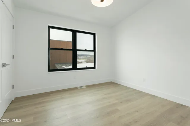a bathroom with a granite countertop sink a toilet and a bathtub