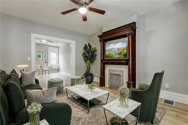 a living room with furniture and a fireplace