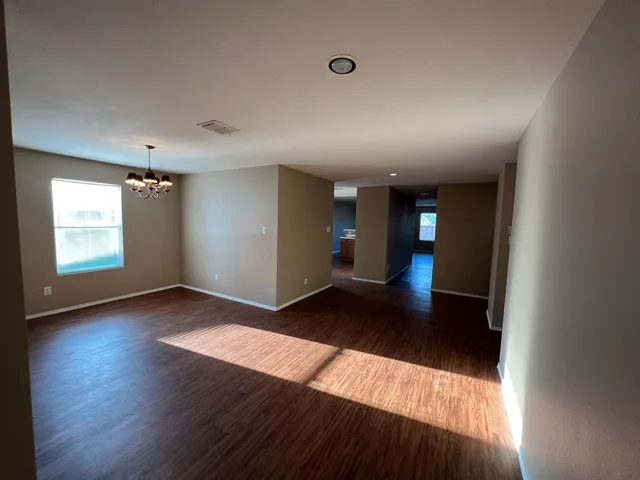 a view of an empty room and window