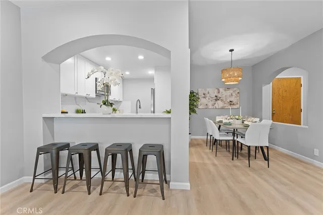 a kitchen with a sink stove and microwave