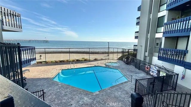 a view of a terrace with lawn chairs