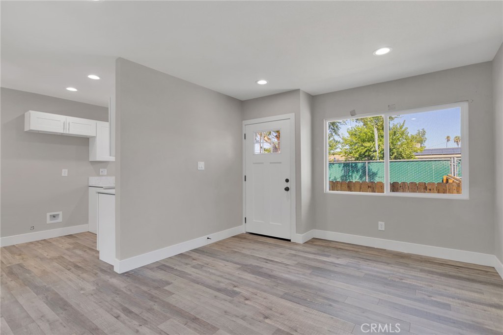 24521 Myers Avenue Moreno Valley, CA 92553 - Photo 3 of 9 a view of wooden floor and windows in a room