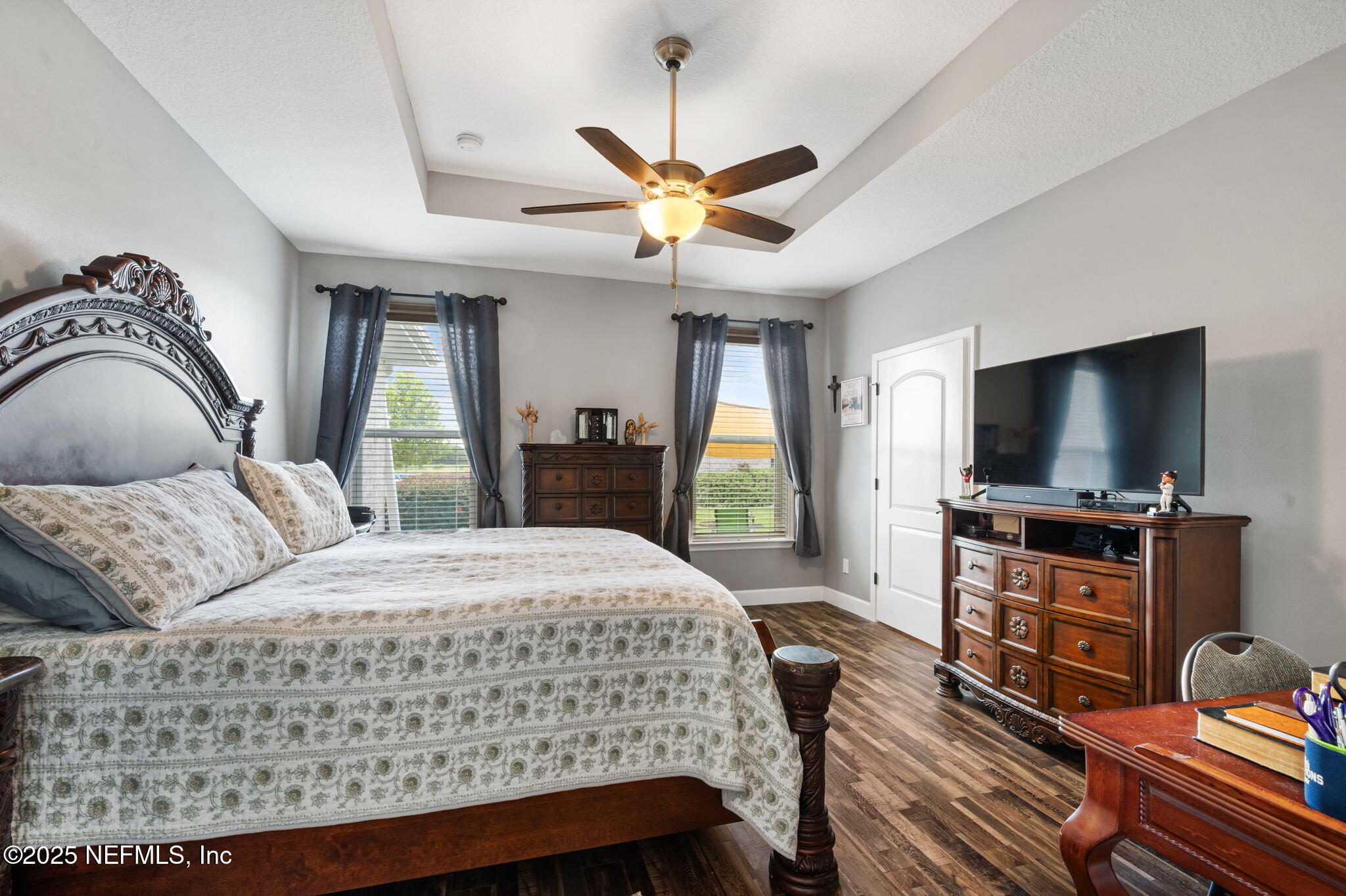 272344 Conner-Nelson Hilliard, FL 32046 - Photo 16 of 56 a bedroom with a bed and a flat screen tv