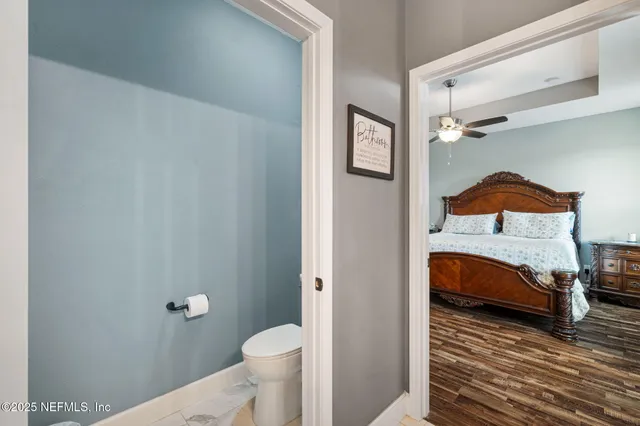 a bathroom with a double vanity sink toilet and shower