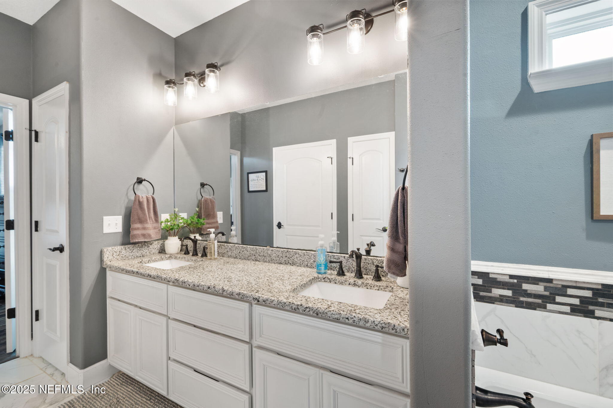 272344 Conner-Nelson Hilliard, FL 32046 - Photo 19 of 56 a bathroom with a granite countertop double vanity sink and a mirror