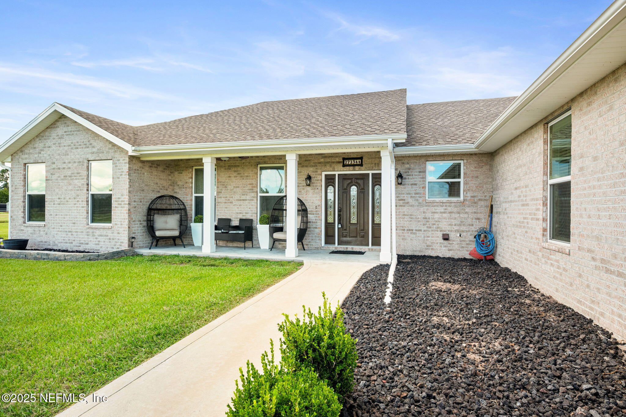 272344 Conner-Nelson Hilliard, FL 32046 - Photo 2 of 56 a front view of a house with garden