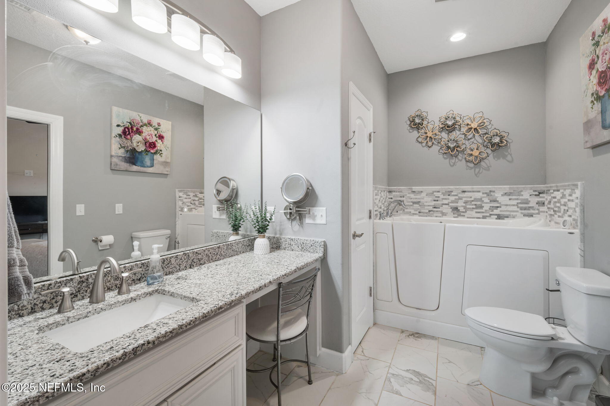 272344 Conner-Nelson Hilliard, FL 32046 - Photo 23 of 56 a bathroom with a granite countertop sink mirror vanity and toilet