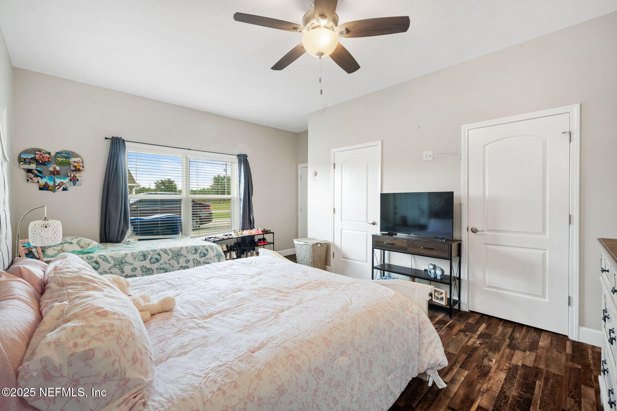 272344 Conner-Nelson Hilliard, FL 32046 - Photo 25 of 56 a bedroom with a bed and a flat screen tv