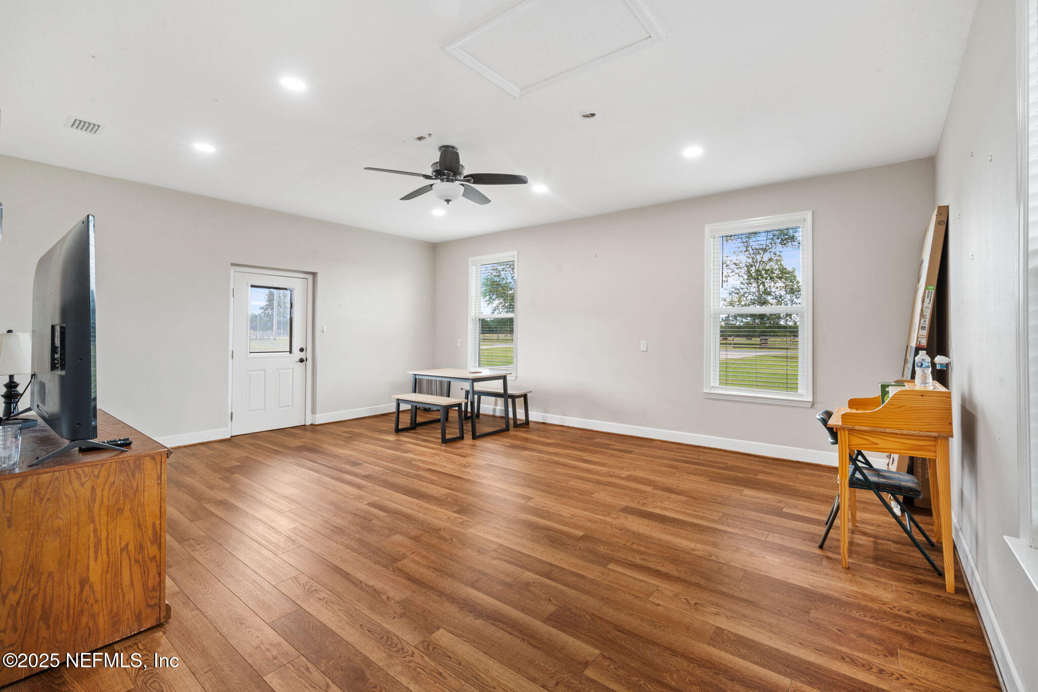 272344 Conner-Nelson Hilliard, FL 32046 - Photo 28 of 56 a view of a livingroom with furniture and a workspace