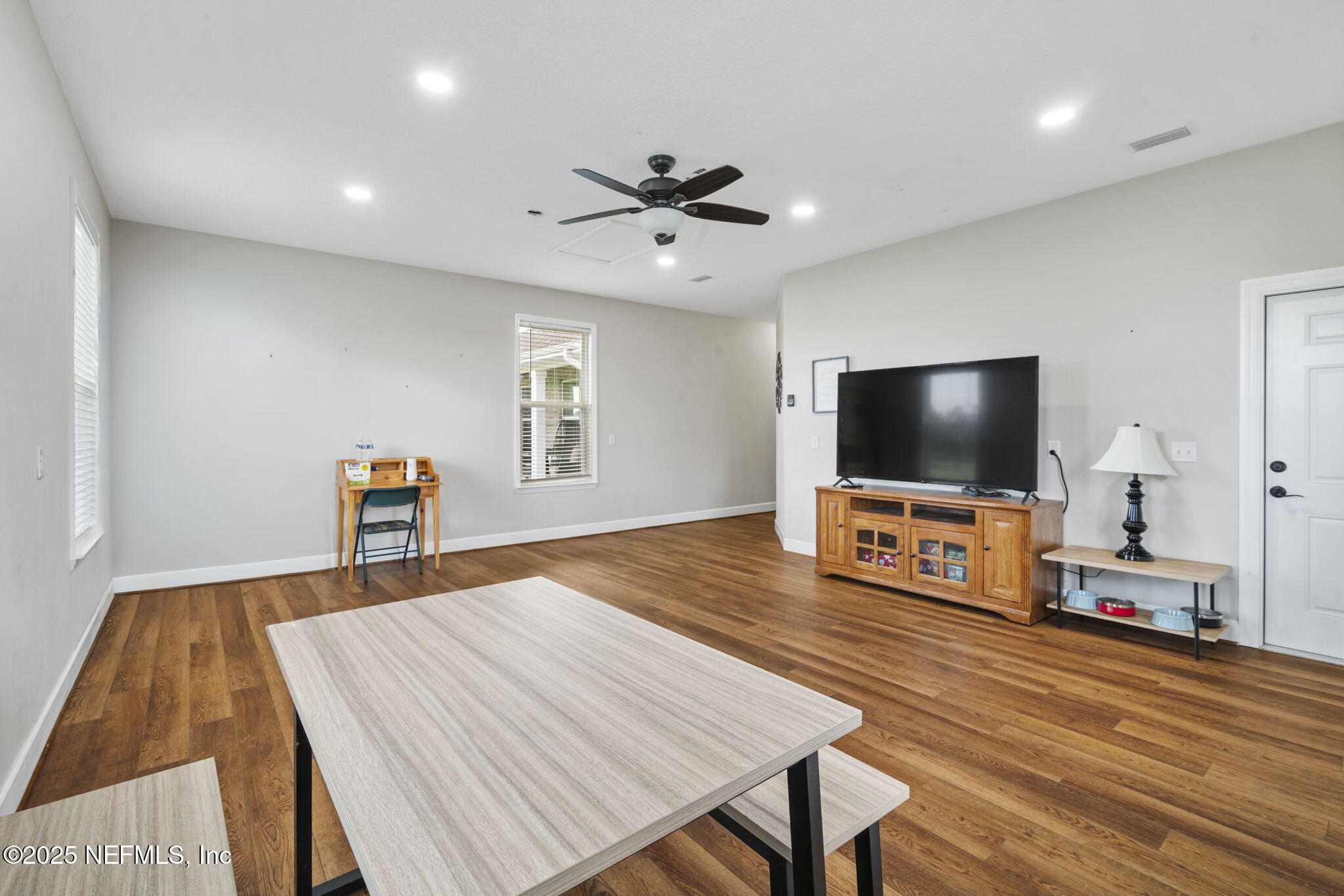 272344 Conner-Nelson Hilliard, FL 32046 - Photo 30 of 56 a living room with furniture and a flat screen tv