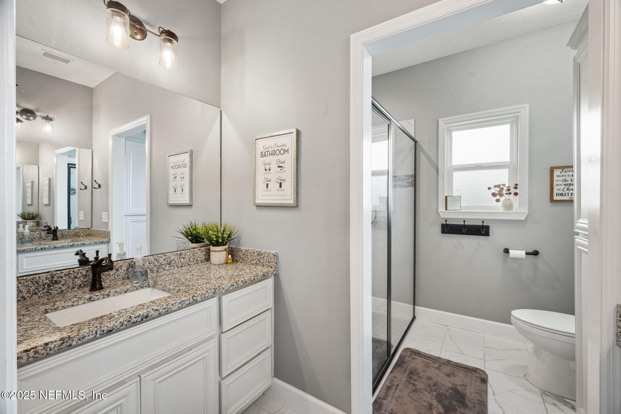 272344 Conner-Nelson Hilliard, FL 32046 - Photo 32 of 56 a bathroom with a granite countertop sink toilet and shower