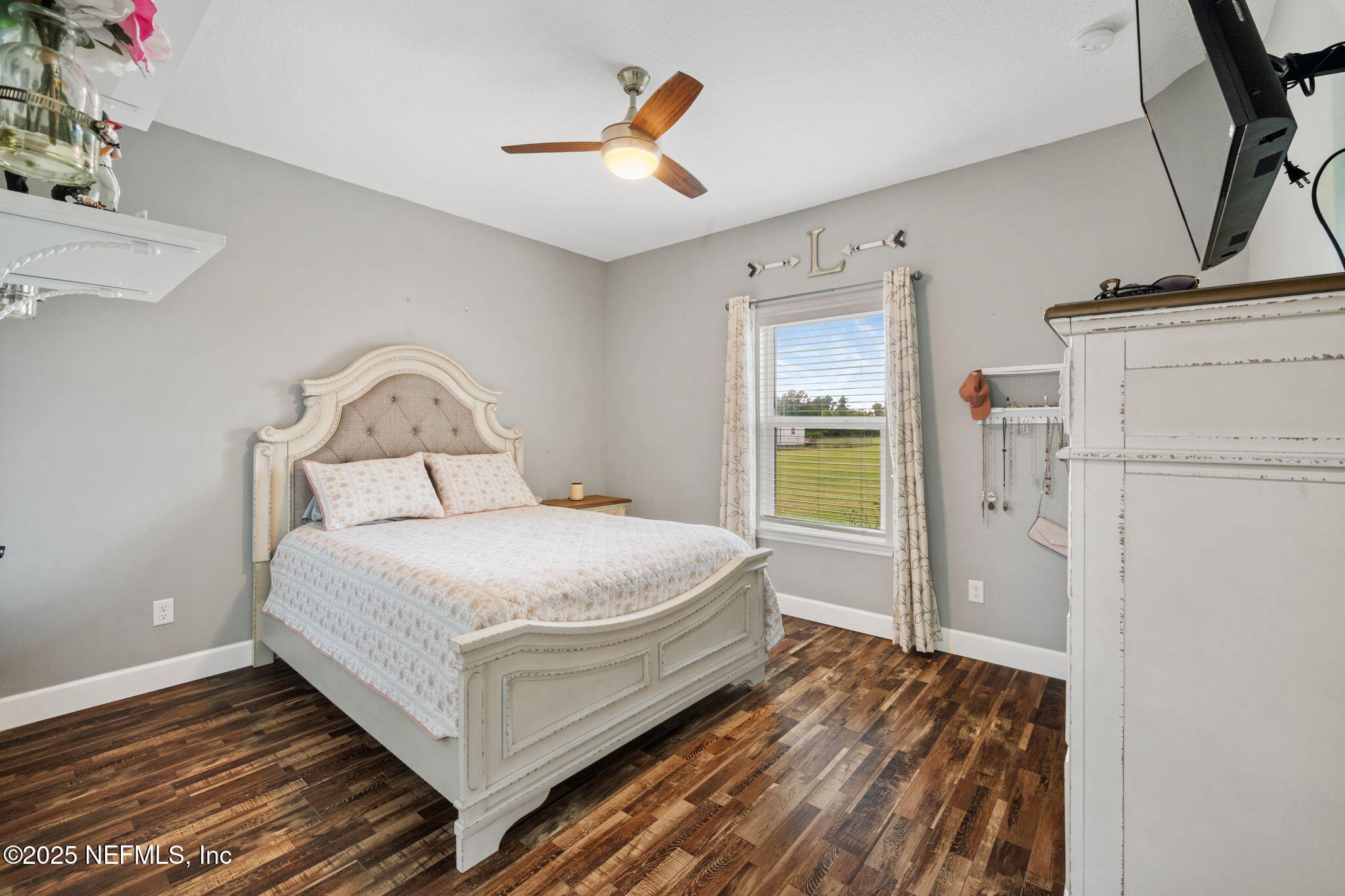272344 Conner-Nelson Hilliard, FL 32046 - Photo 35 of 56 a bedroom with a bed and a window