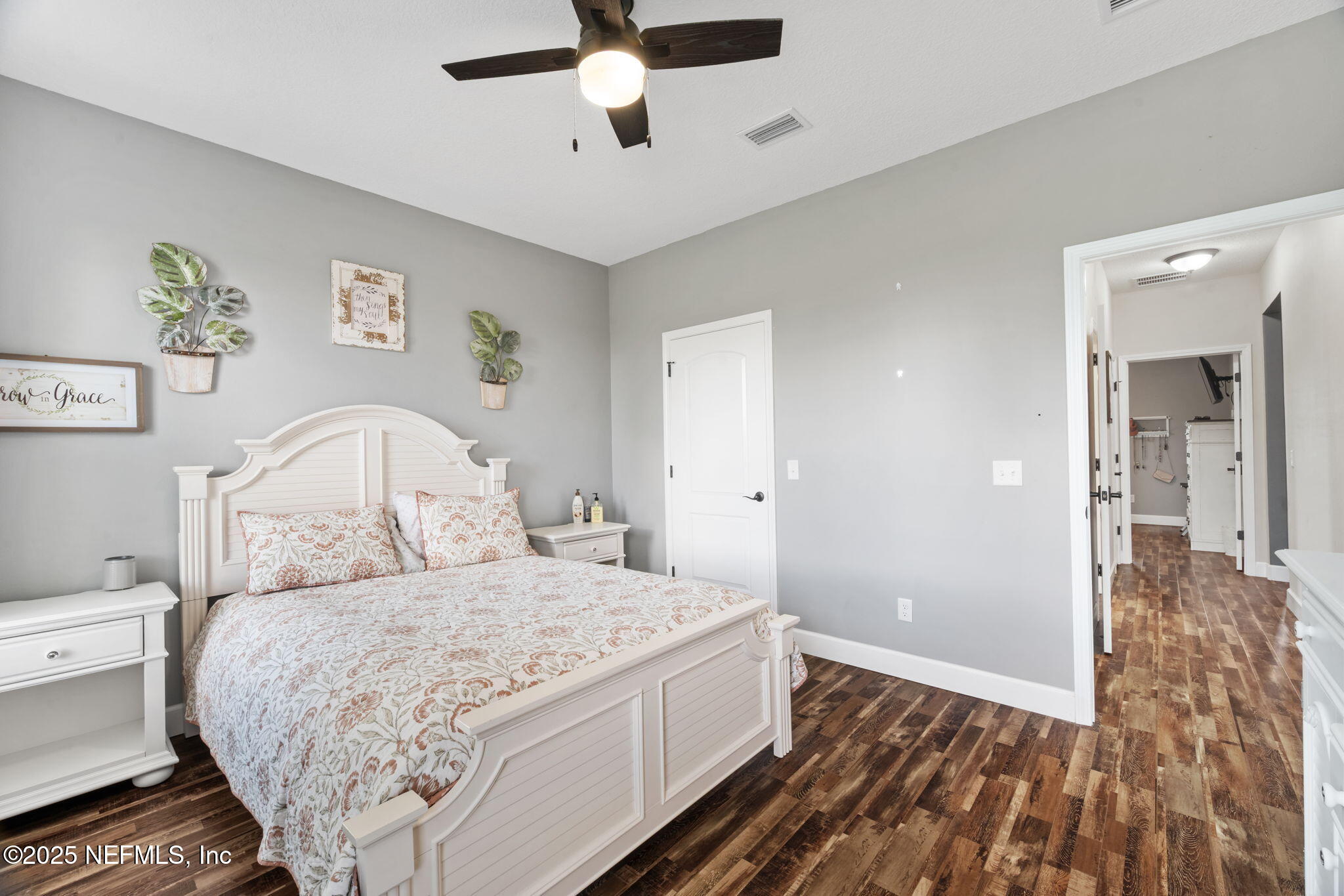 272344 Conner-Nelson Hilliard, FL 32046 - Photo 37 of 56 a bedroom with a bed and a chandelier