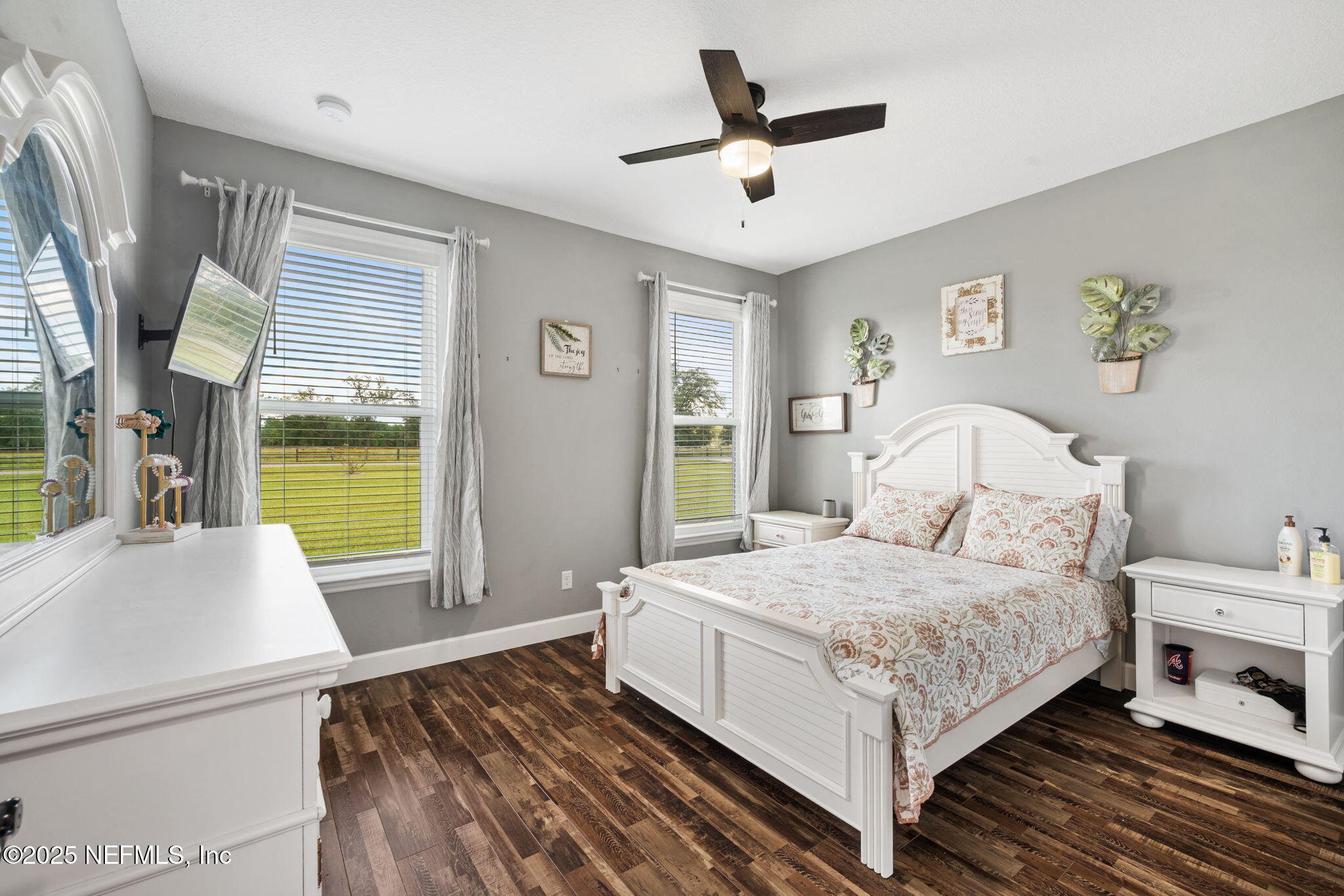 272344 Conner-Nelson Hilliard, FL 32046 - Photo 38 of 56 a bedroom with a bed and a large window