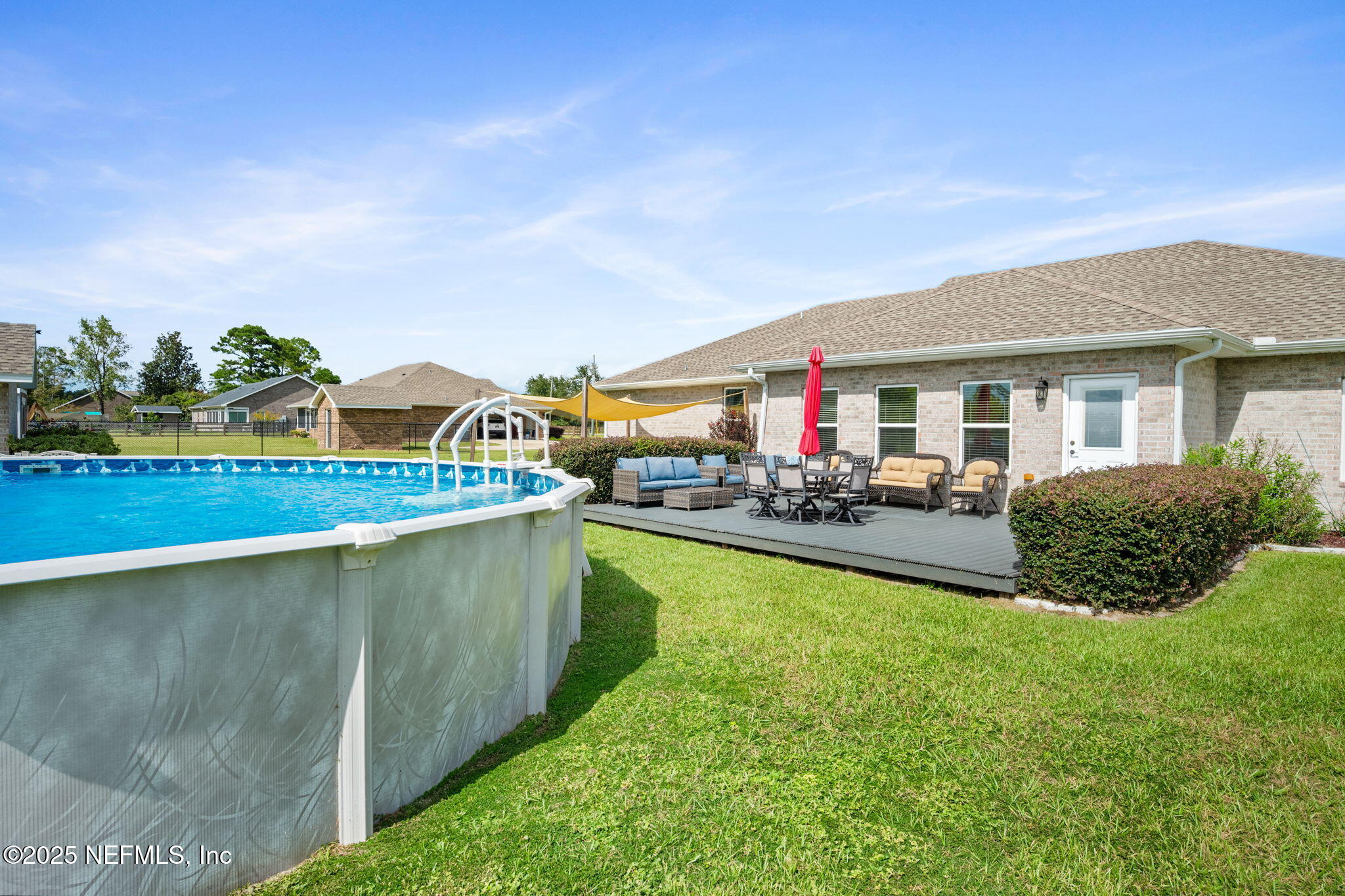 272344 Conner-Nelson Hilliard, FL 32046 - Photo 41 of 56 a view of swimming pool with outdoor seating and a garden