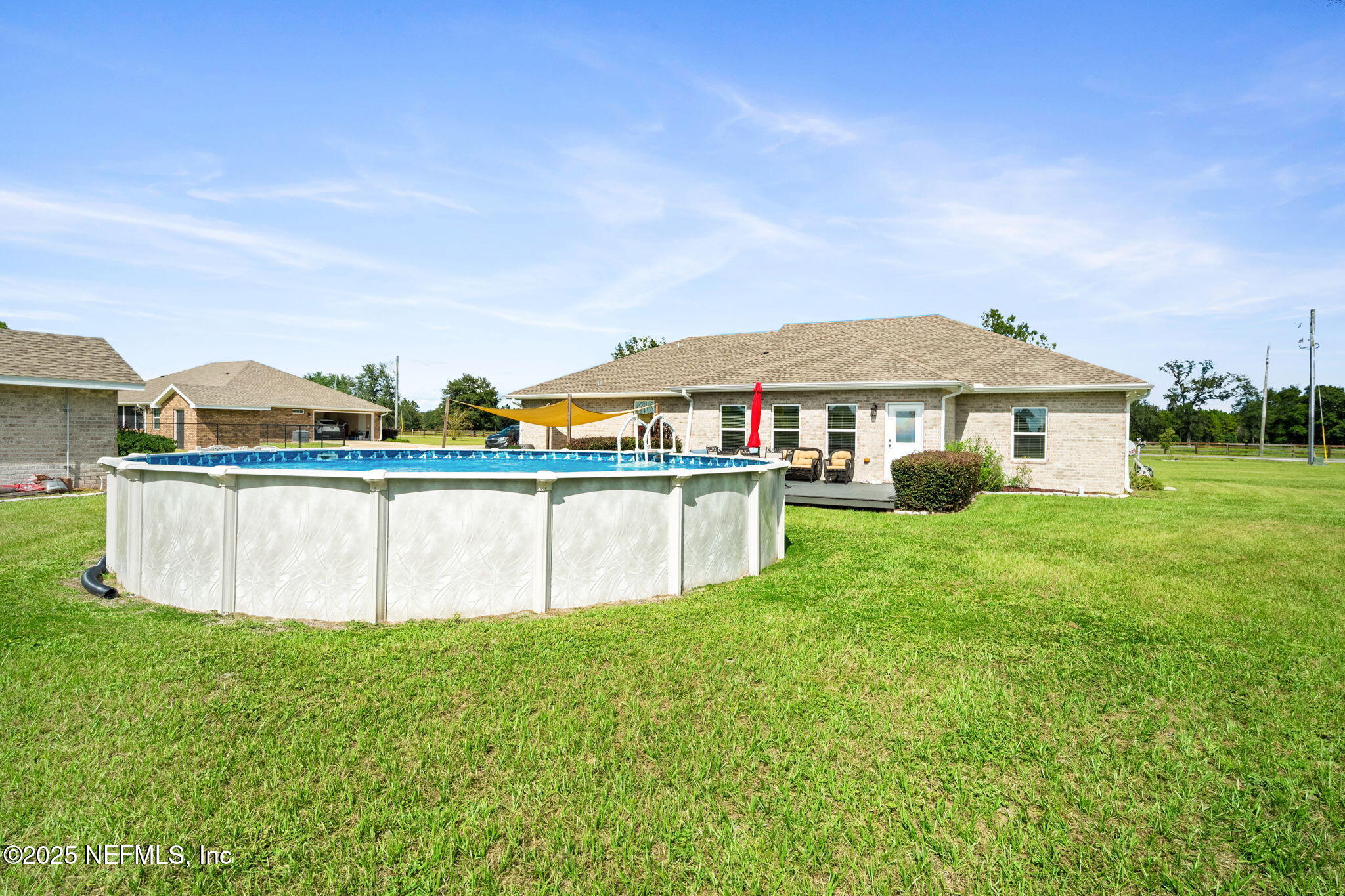 272344 Conner-Nelson Hilliard, FL 32046 - Photo 42 of 56 a view of house with outdoor space and sitting area