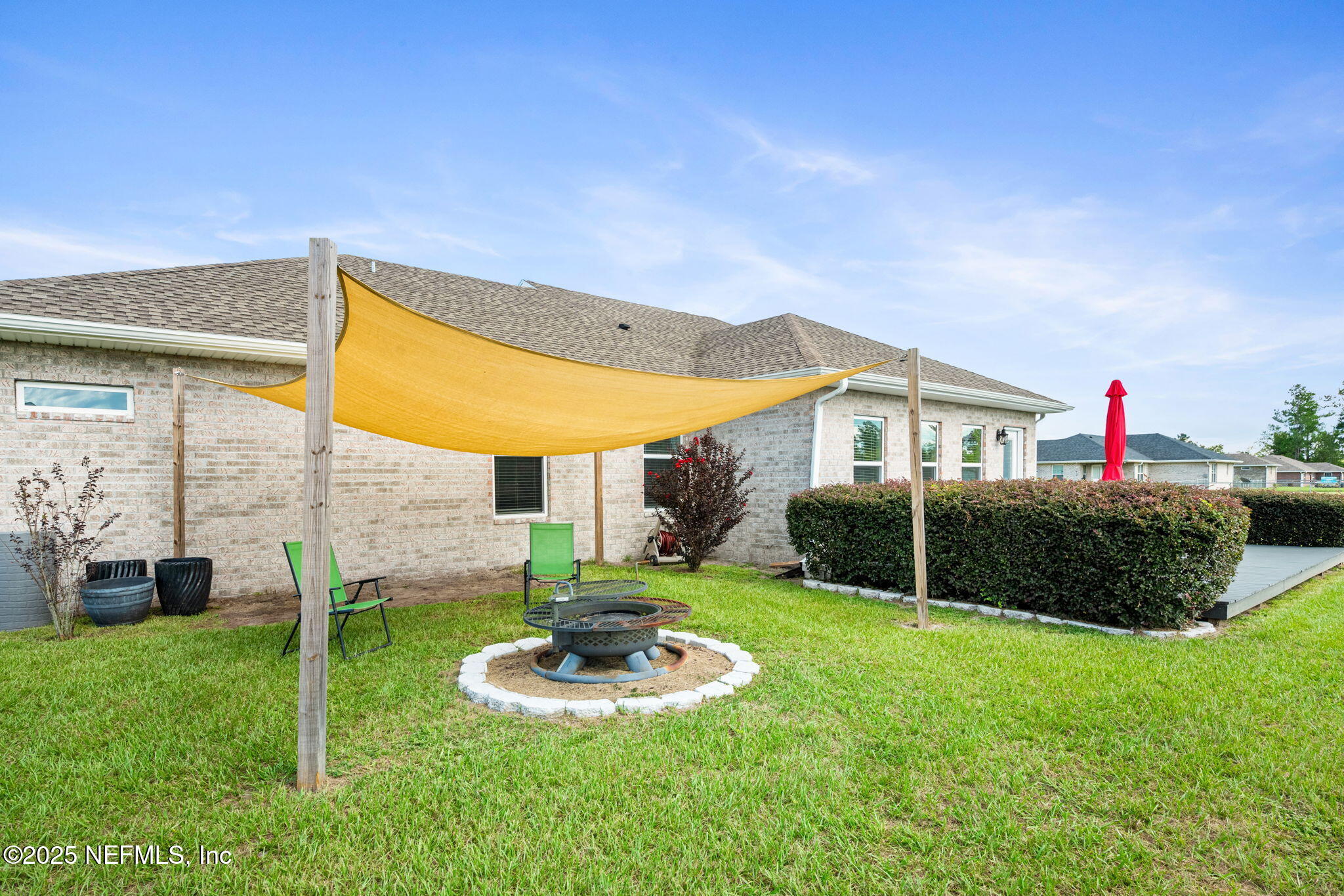 272344 Conner-Nelson Hilliard, FL 32046 - Photo 43 of 56 a front view of house with yard and outdoor seating