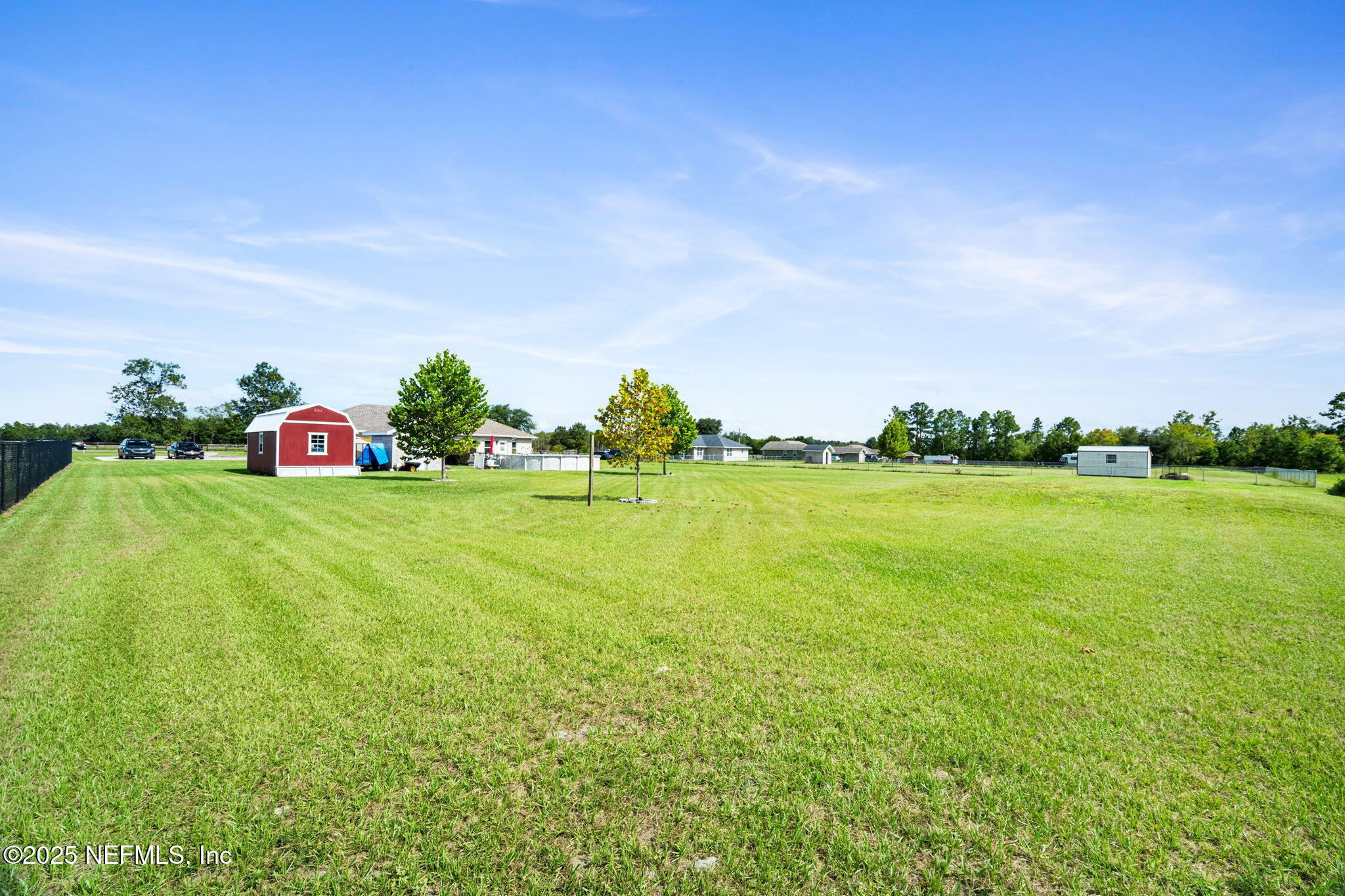 272344 Conner-Nelson Hilliard, FL 32046 - Photo 45 of 56 a view of a garden with a building in the background