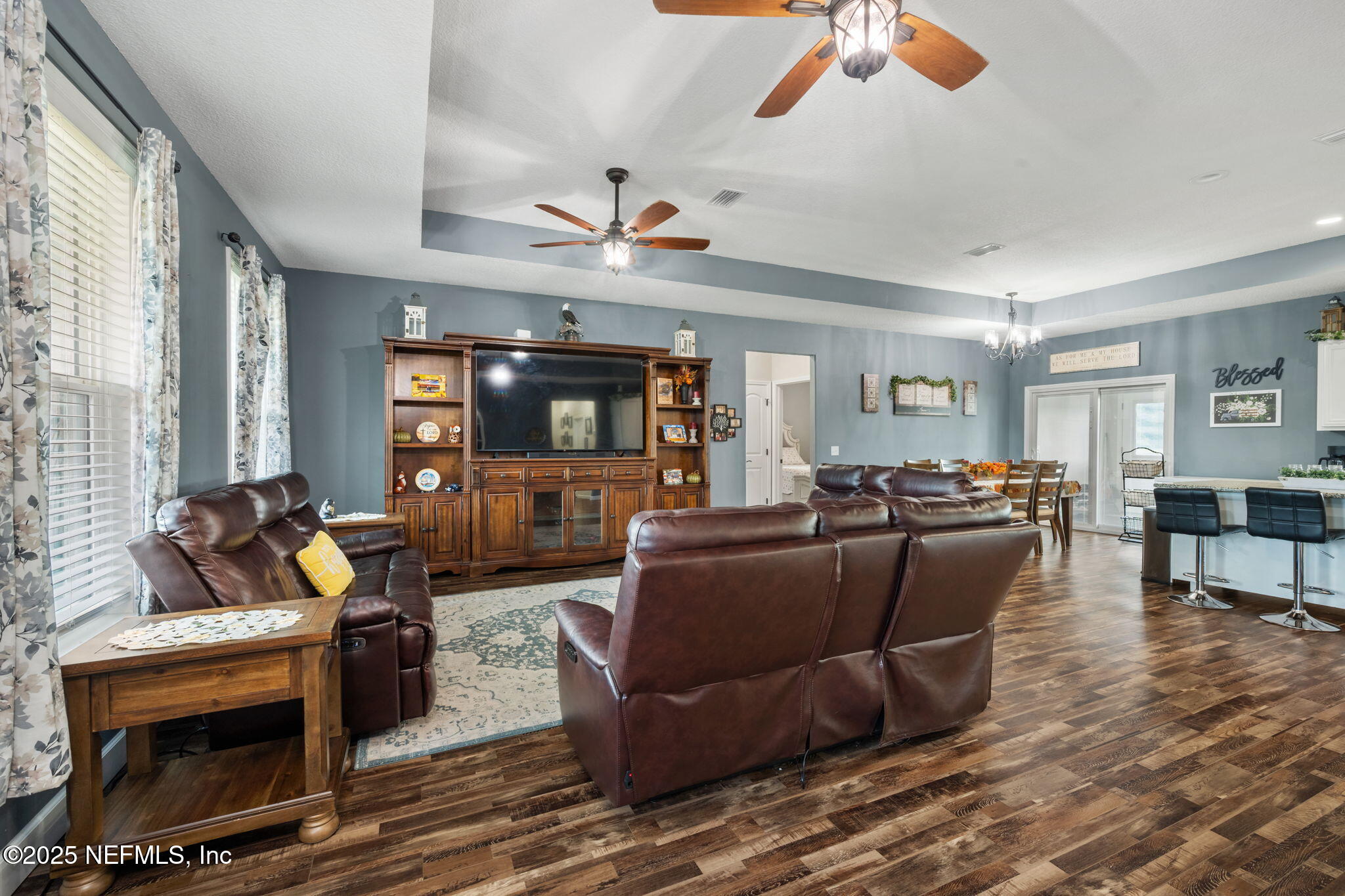 272344 Conner-Nelson Hilliard, FL 32046 - Photo 5 of 56 a living room with furniture and a flat screen tv