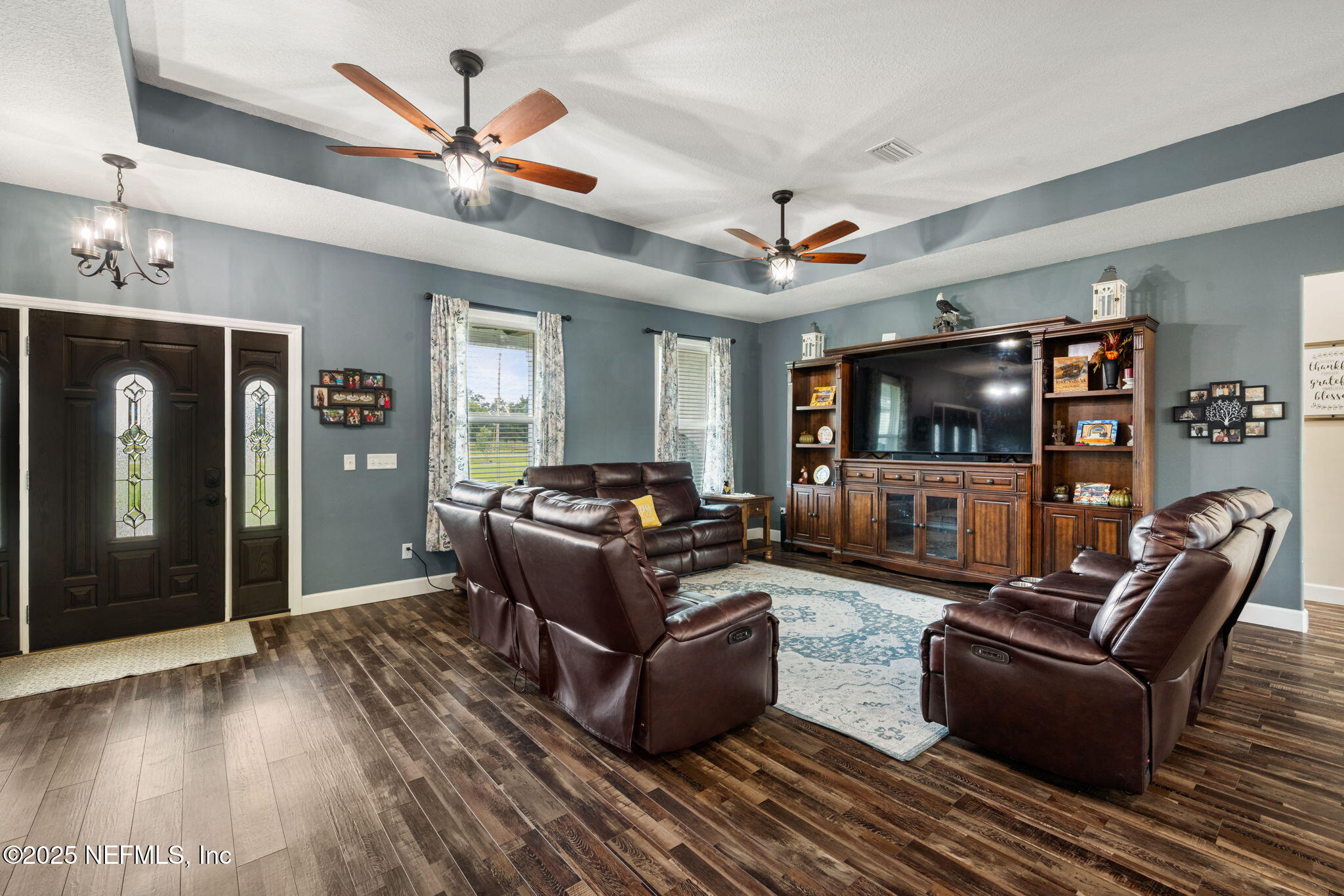 272344 Conner-Nelson Hilliard, FL 32046 - Photo 6 of 56 a living room with furniture and a flat screen tv