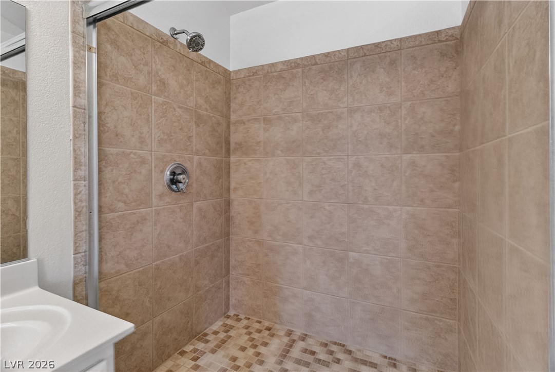 3156 Terrace View Drive Laughlin, NV 89029 - Photo 35 of 94 A well-maintained shower featuring neutral-toned tile work and a mosaic floor.
